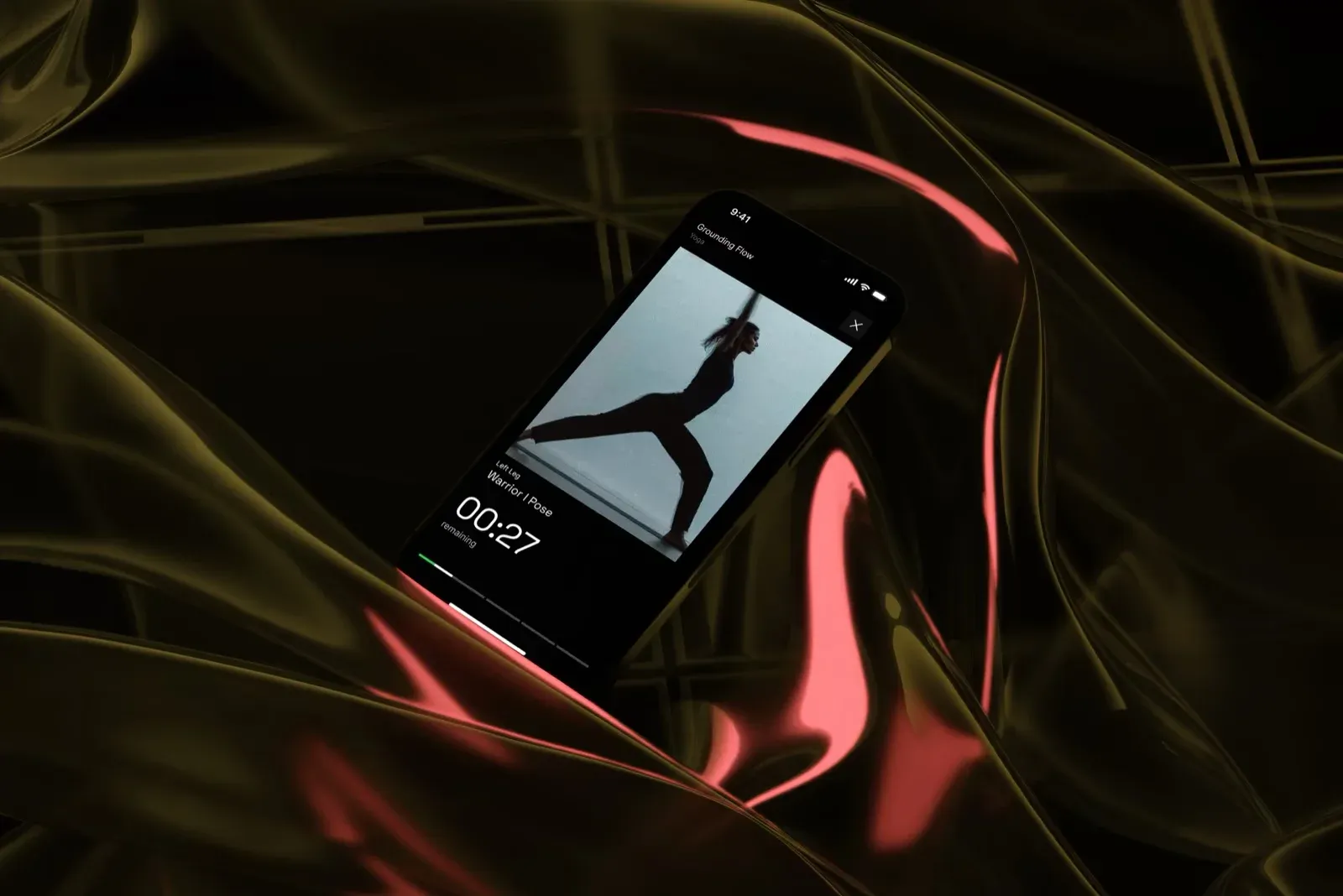 The Endor app showing a session timer on a phone over red and gold silk.