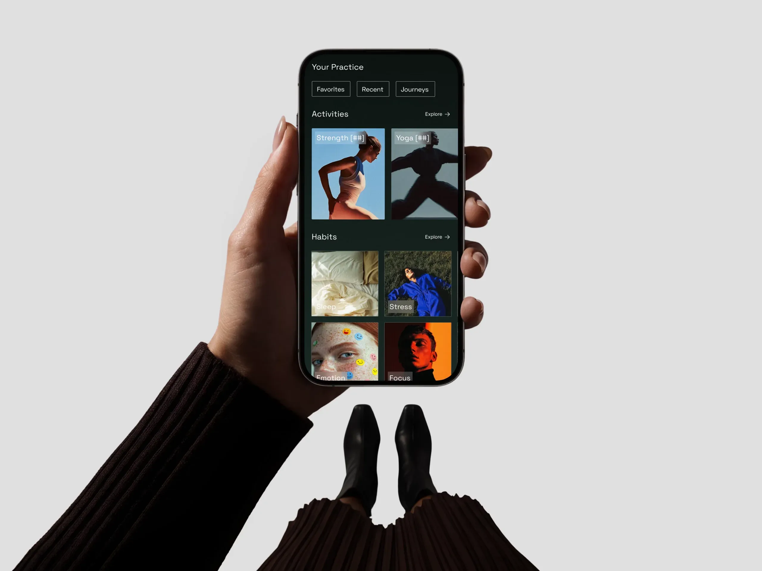 A hand holding a phone showing the Endor app’s “Your Practice” library over a neutral background.