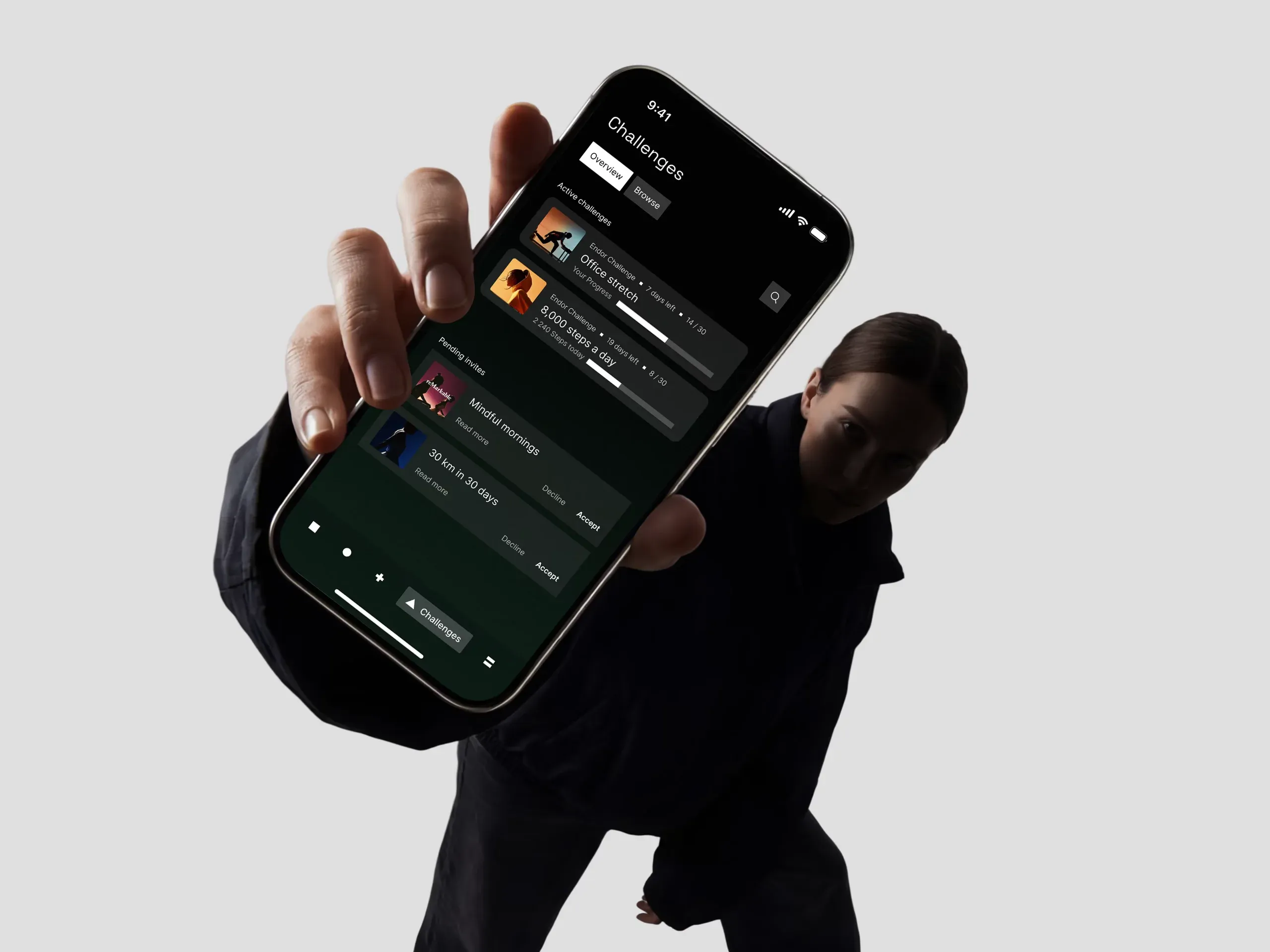 A phone held out towards the camera showing the Endor app’s session list.